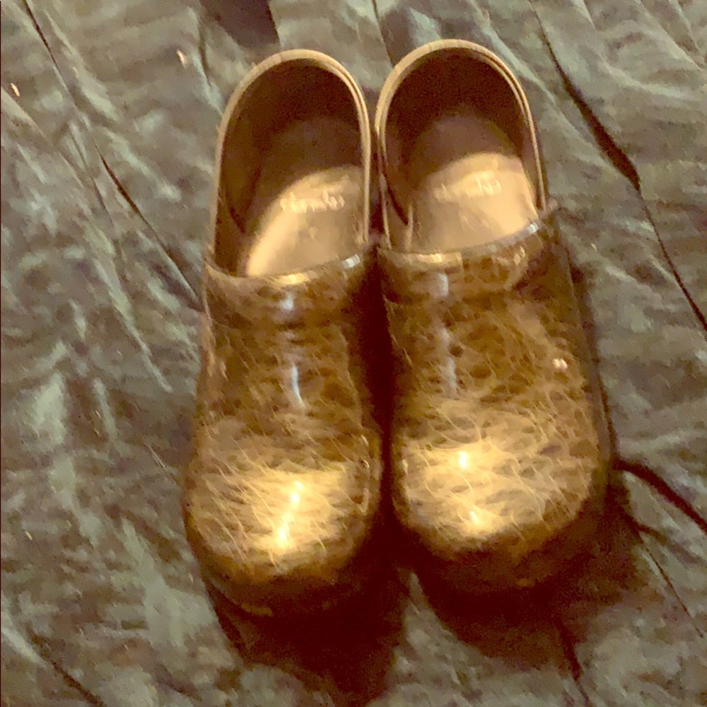 Silver and black clogs